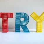 The word TRY spelled out in red, blue and yellow