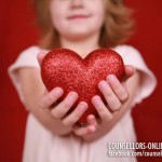 A girl is holding a heart.