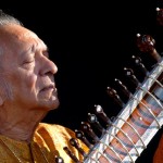 An old man playing a Sitar