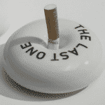 a cigarette in an ashtray.