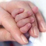 Mother and baby's hand